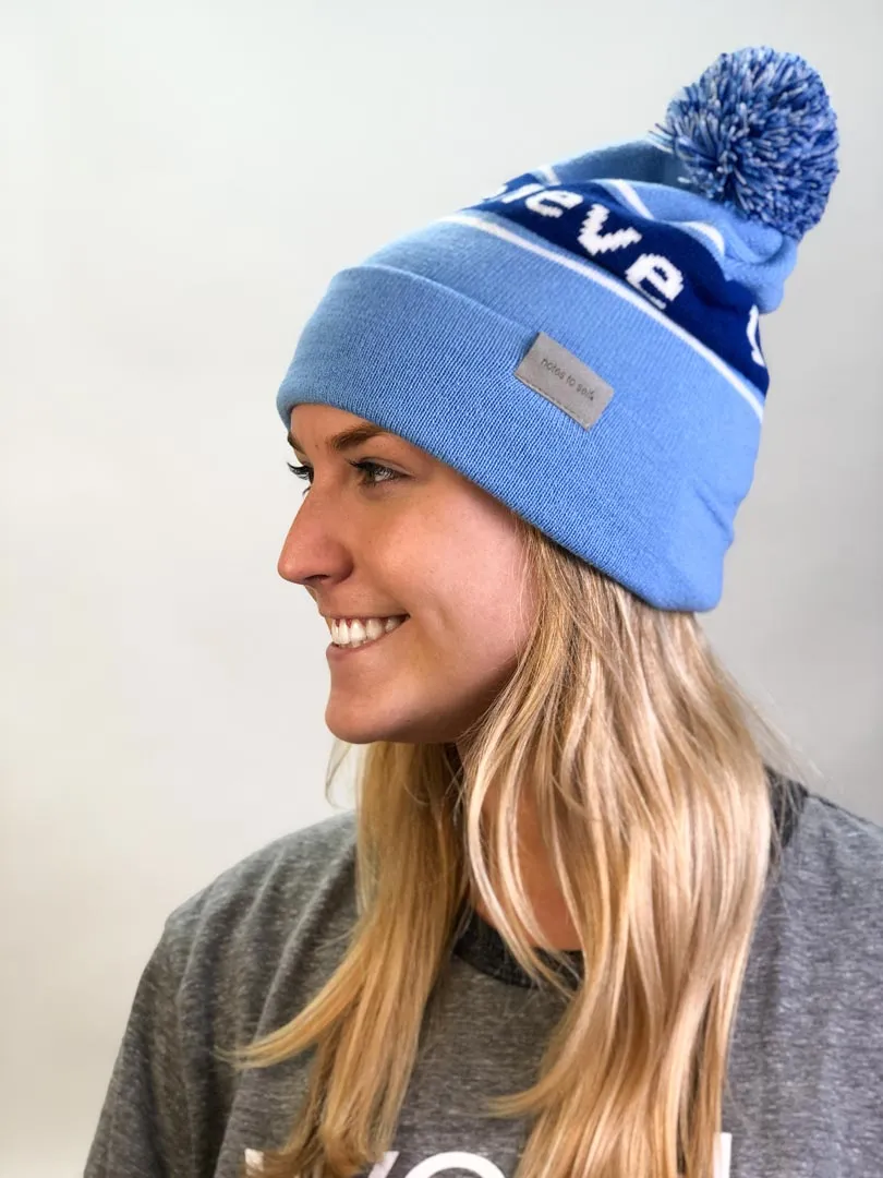 I believe™ blue knit beanie with I am optimistic™ on inside cuff