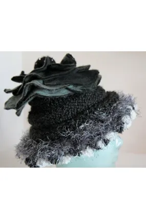 Whimsical black with white and gray hand knit and felt flower hat.