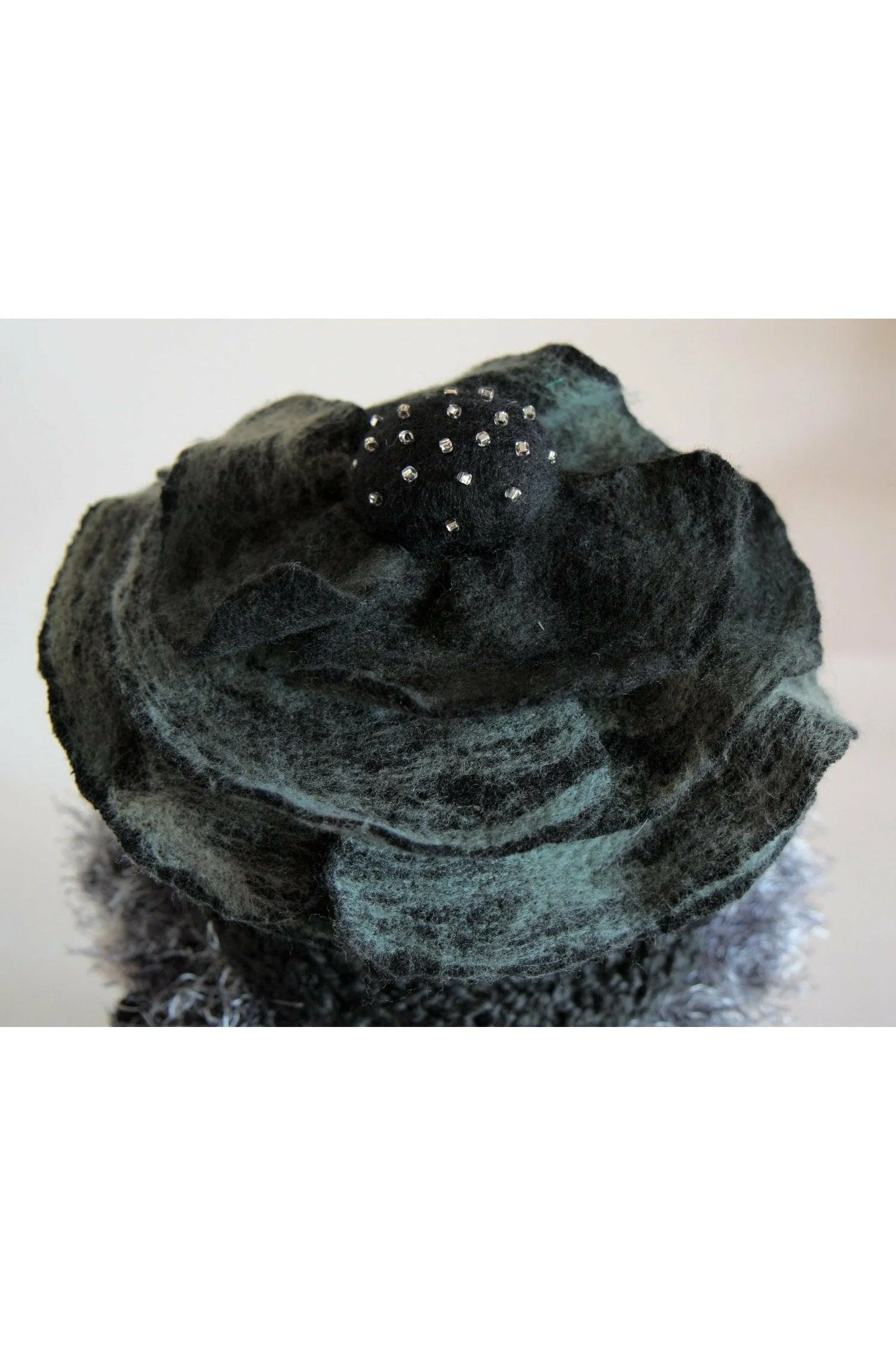 Whimsical black with white and gray hand knit and felt flower hat.